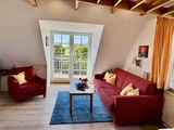 Ferienwohnung in Fehmarn OT Albertsdorf - Weber III - Schlafsofa Sitzbereich Balkon Richtung S&uuml;den