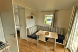 Ferienhaus in Pelzerhaken - Mobilheim M&eacute;diterran&eacute;e im Ferienpark AM WALDRAND - Sitzecke im Wohnbereich